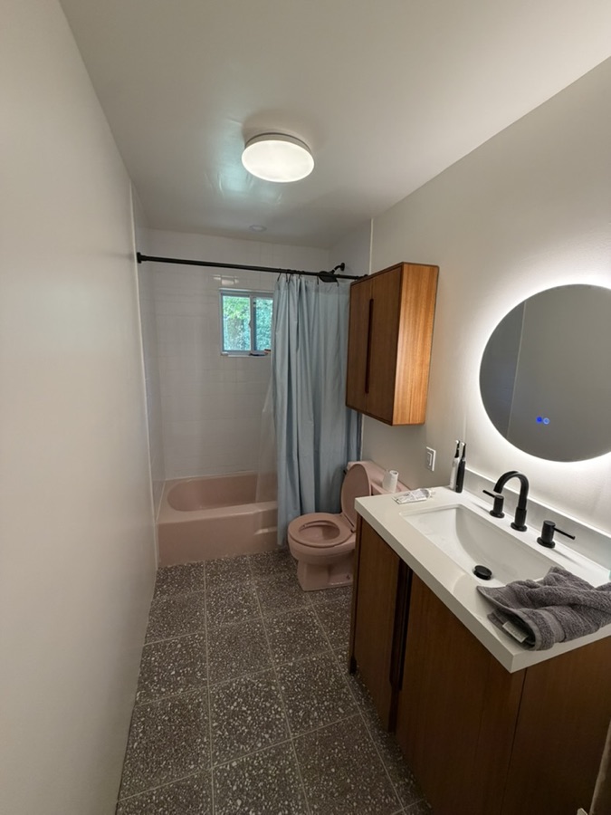 Bathroom update: new vanity, flooring, lighting, and fresh paint, after