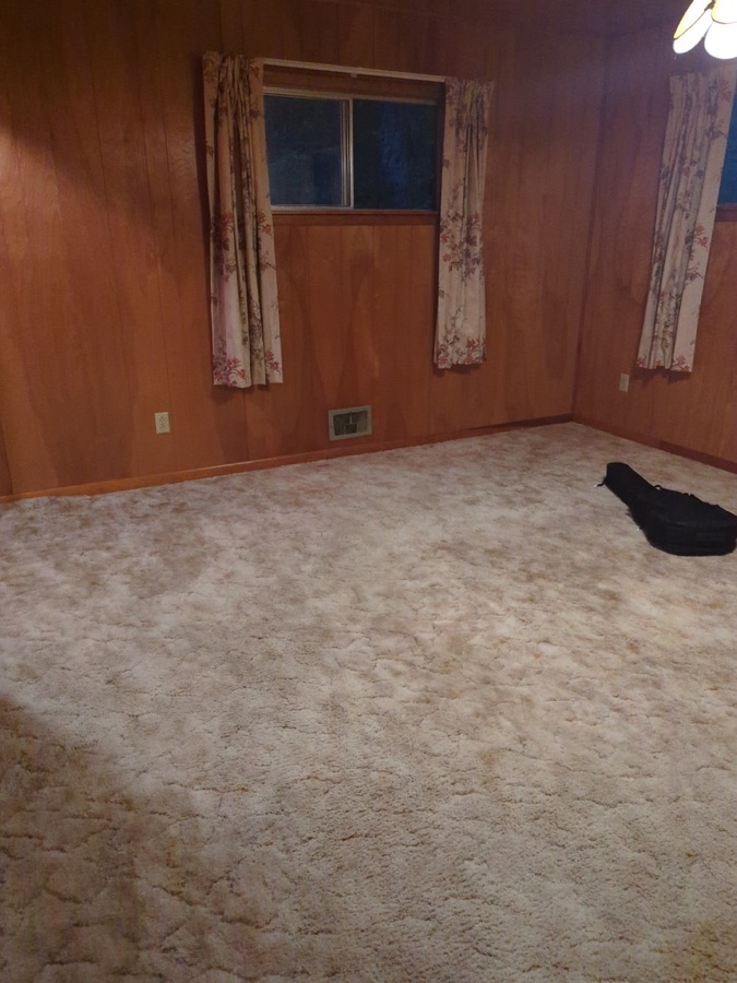 Room refresh: new flooring, ceiling fan, and blinds, before