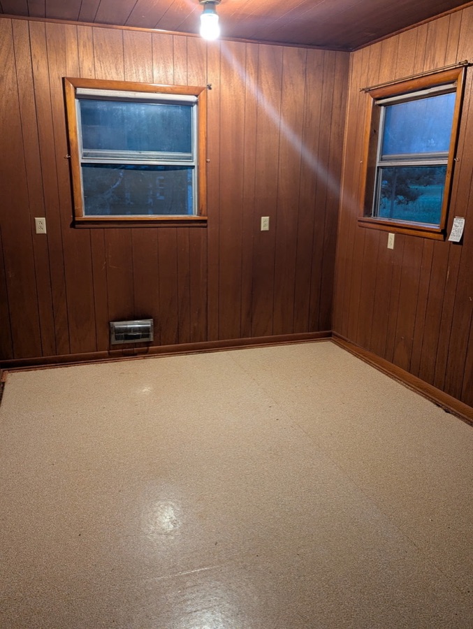 Room makeover: painted walls, new flooring, and ceiling fan, before